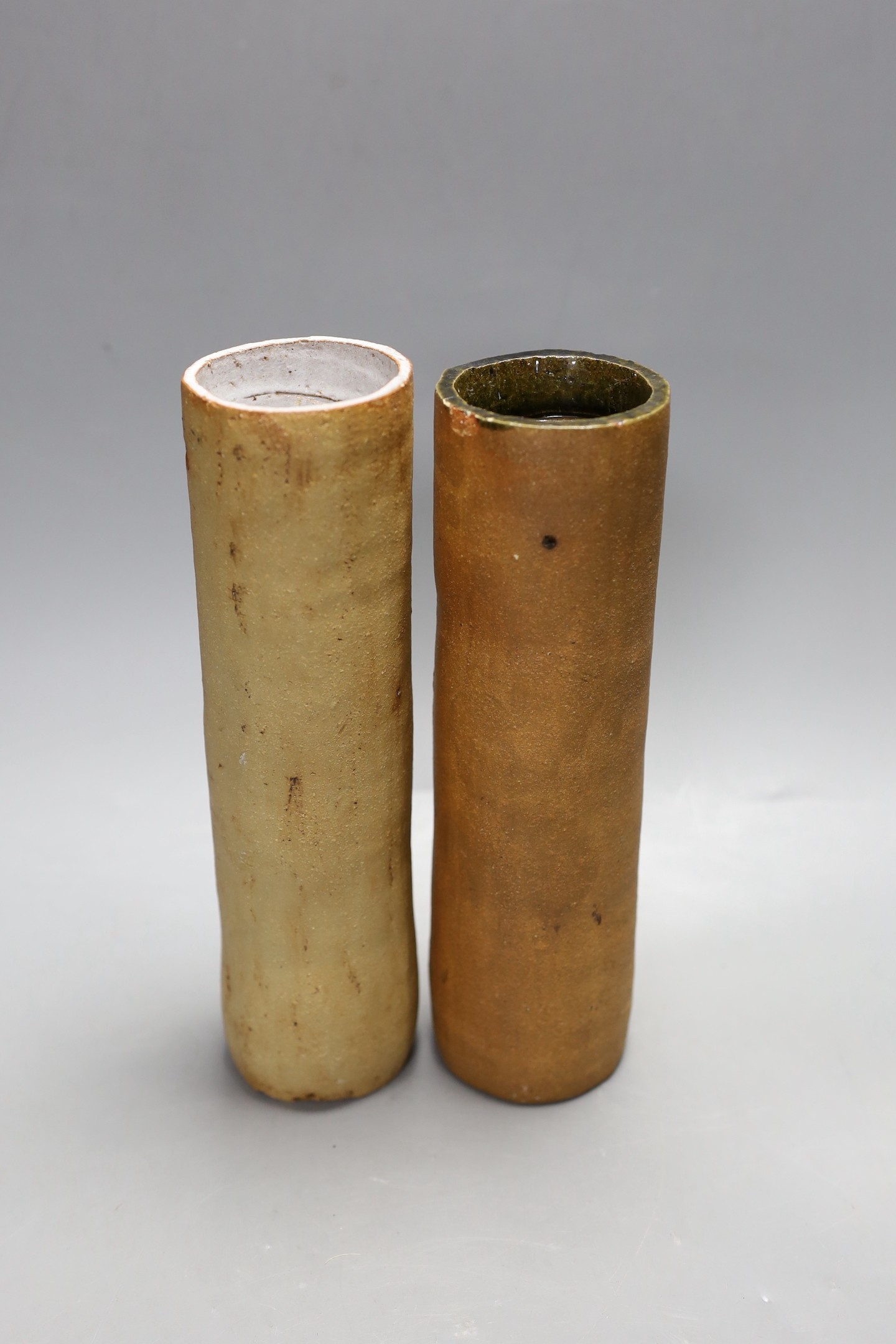 A pair of partially glazed stoneware cylindrical vases, circa 1970, 25cm high